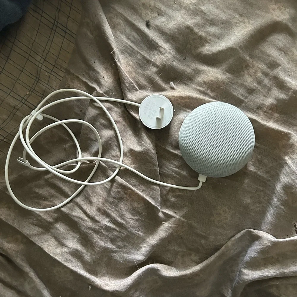 Google Mini Home nest color grey and orange. Comes with power cord.
